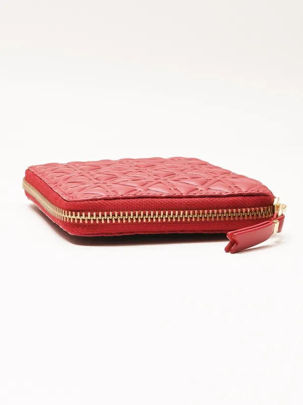 Red Embossed Zip Around Wallet sold by Frances May Houseline