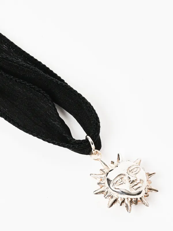 Puffed Sun On Silk Necklace made by Frances May Houseline