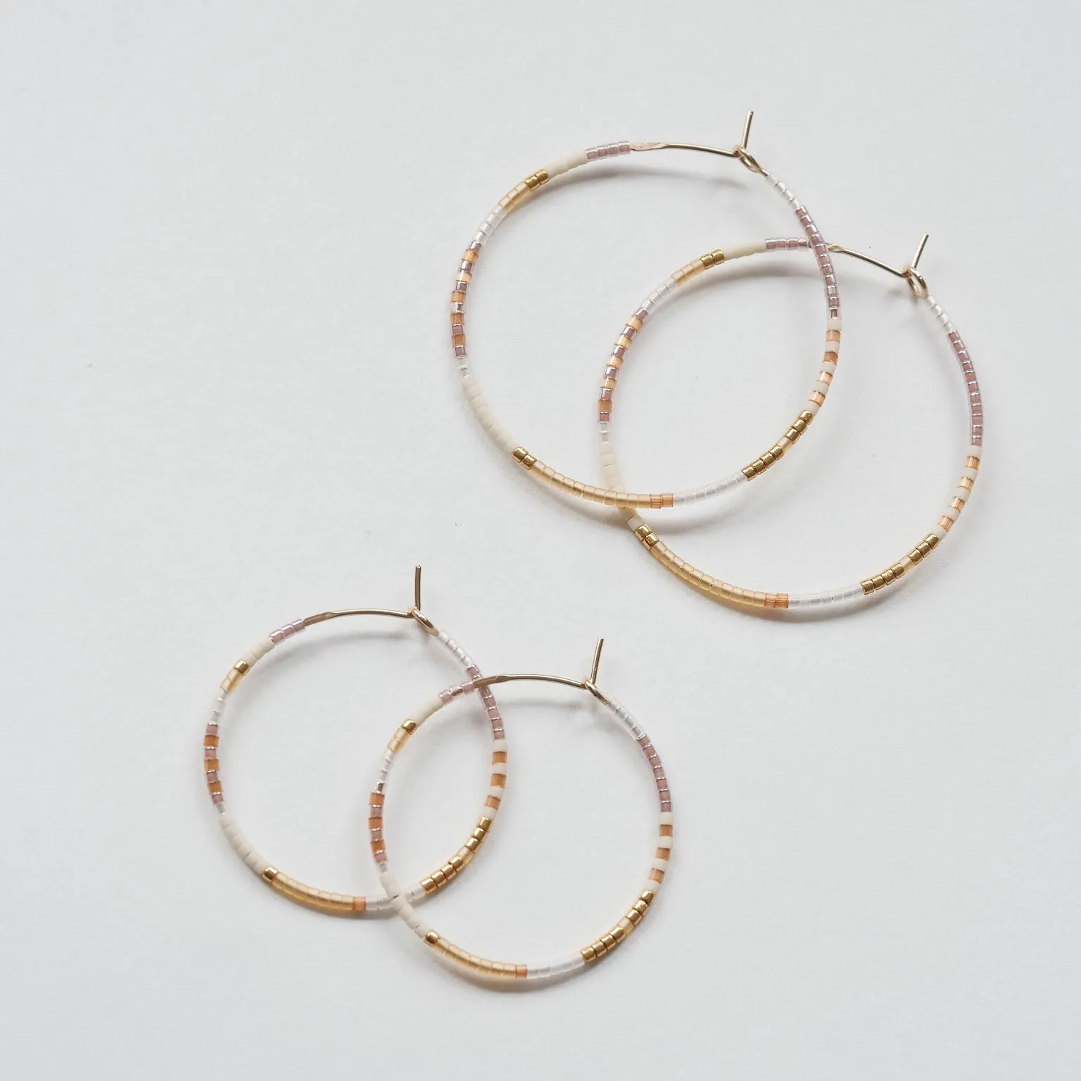 Nive - 1.25" & 1.75" 14 KT Gold Hoops sold by Daldanea
