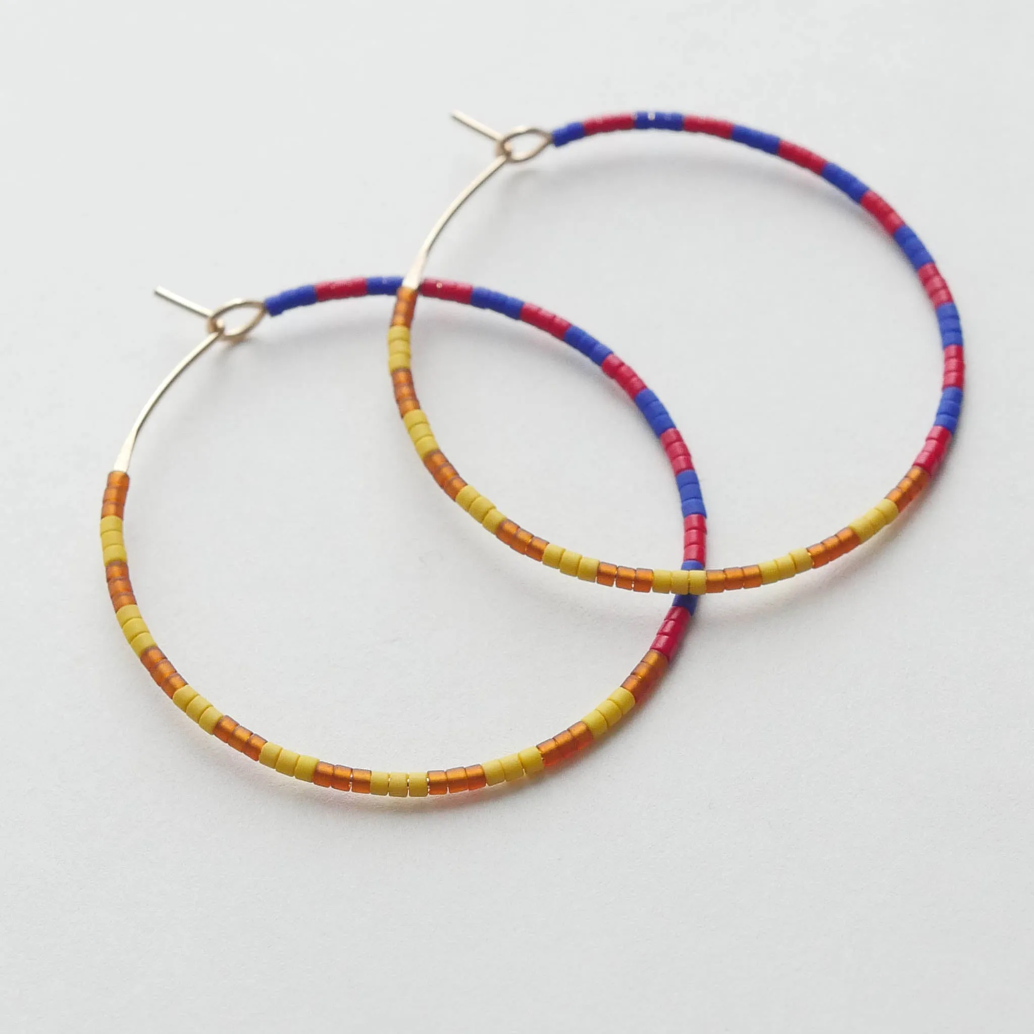 Sunita - 1.25" & 1.75" 14 KT Gold Hoops sold by Daldanea