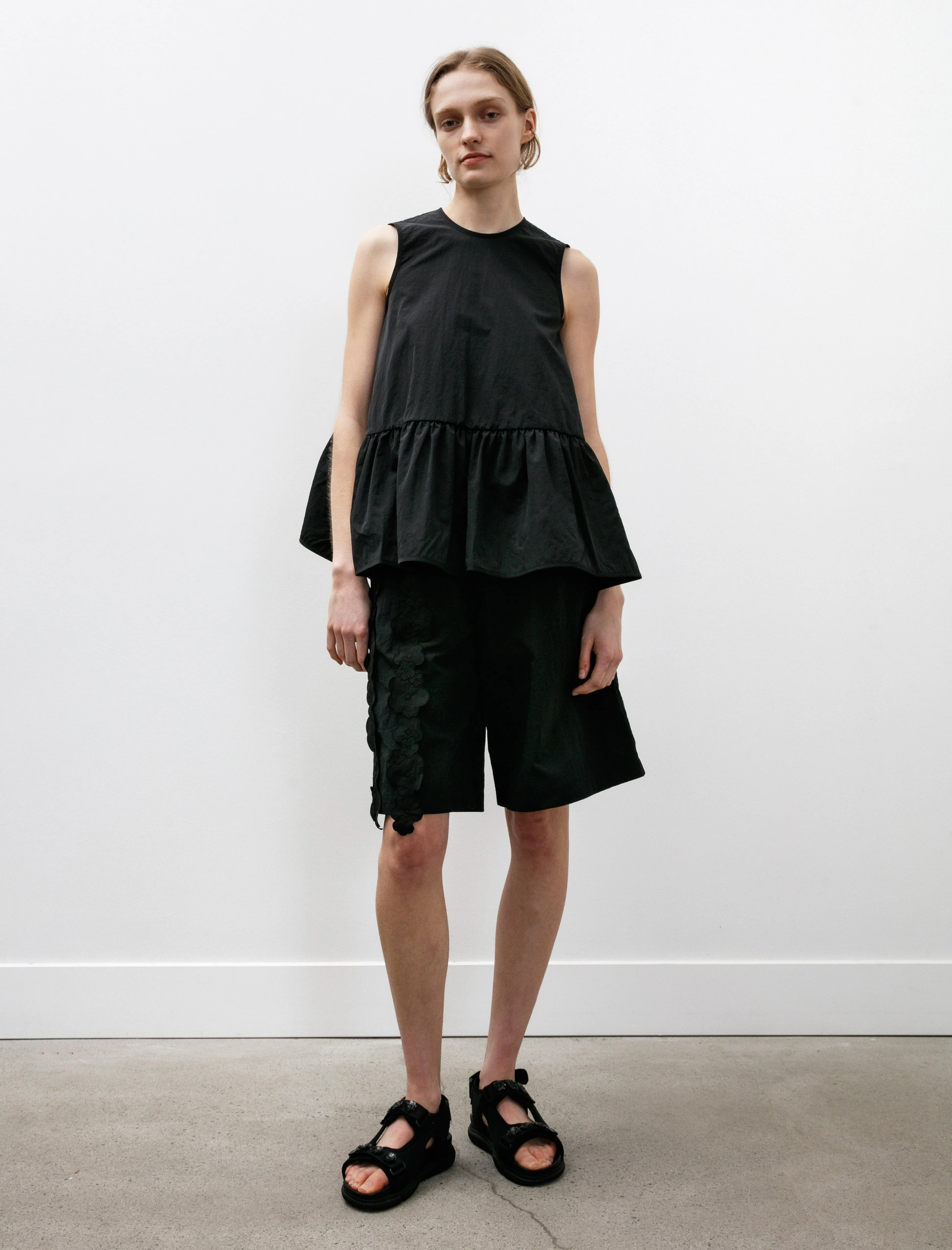 Asta Top with Ruffled Hem Black sold by SHOP NEIGHBOR