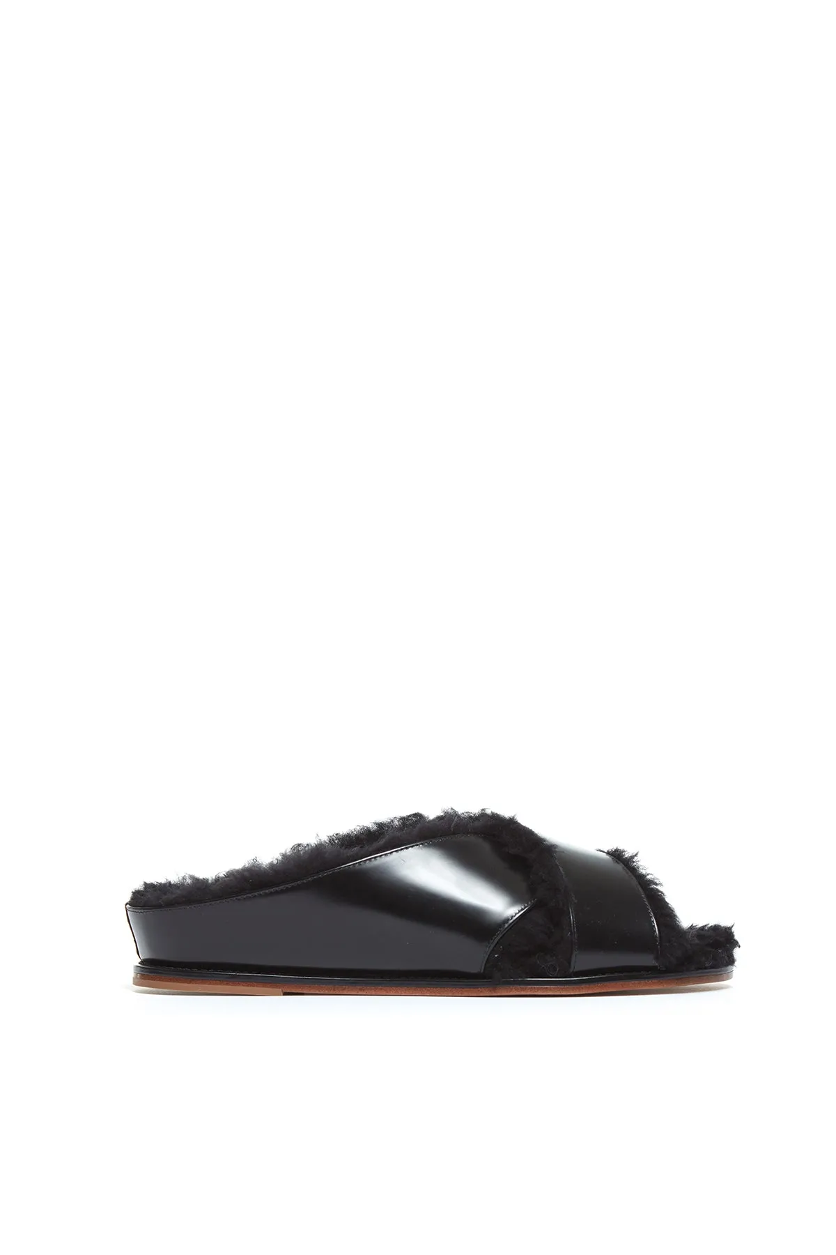 Ellington Flat Slide in Black Leather with Wool Fur sold by Gabriela Hearst