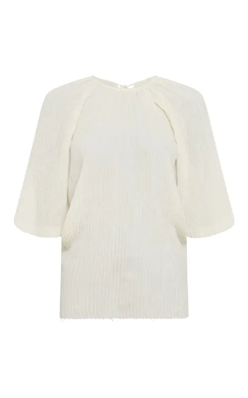 Nula Top in Ivory Plisse Silk sold by Gabriela Hearst