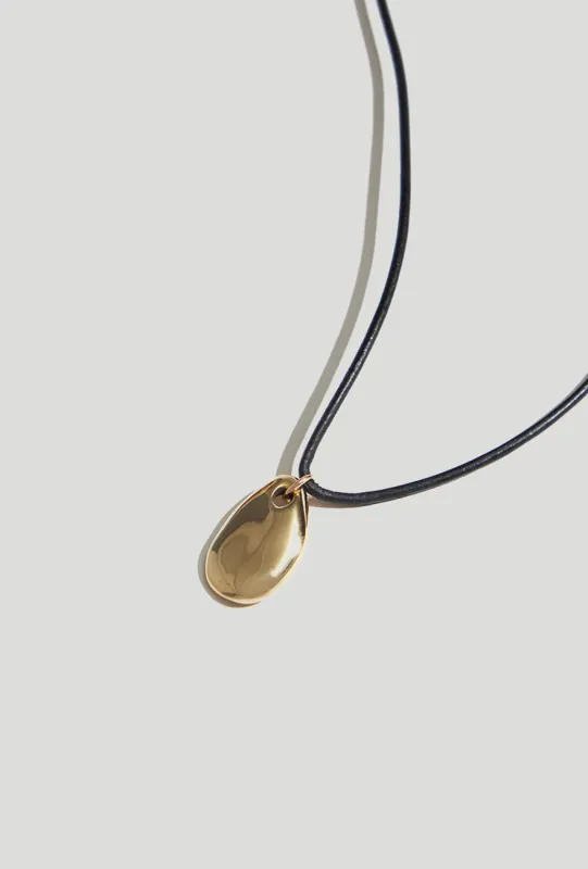 Small Pebble Pendant Necklace Gold Cord sold by Maslo