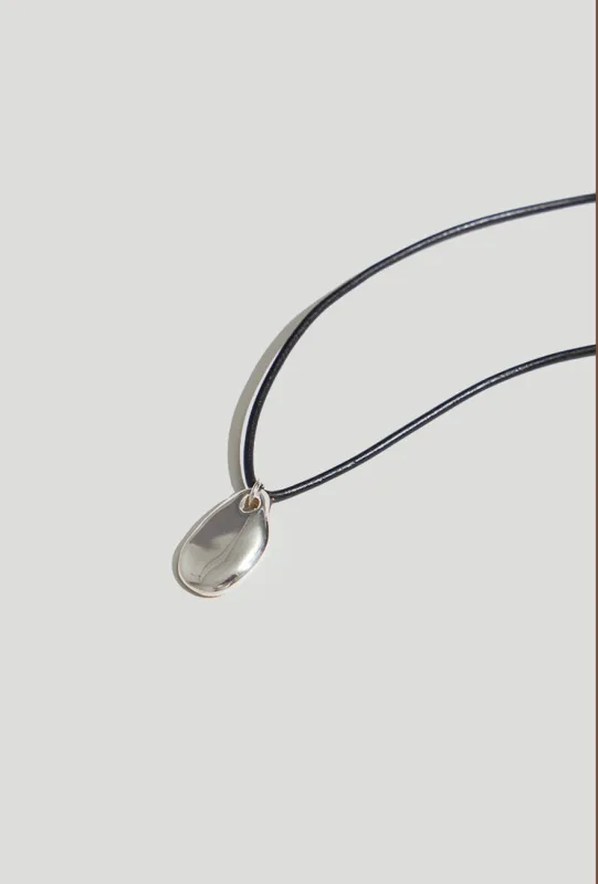Small Pebble Pendant Necklace Sterling Silver Cord sold by Maslo