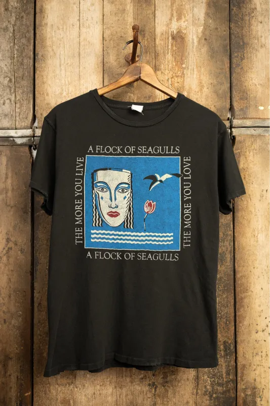 FLOCK OF SEAGULLS THE MORE YOU LIVE, THE MORE YOU LOVE '90S FIT sold by MadeWorn