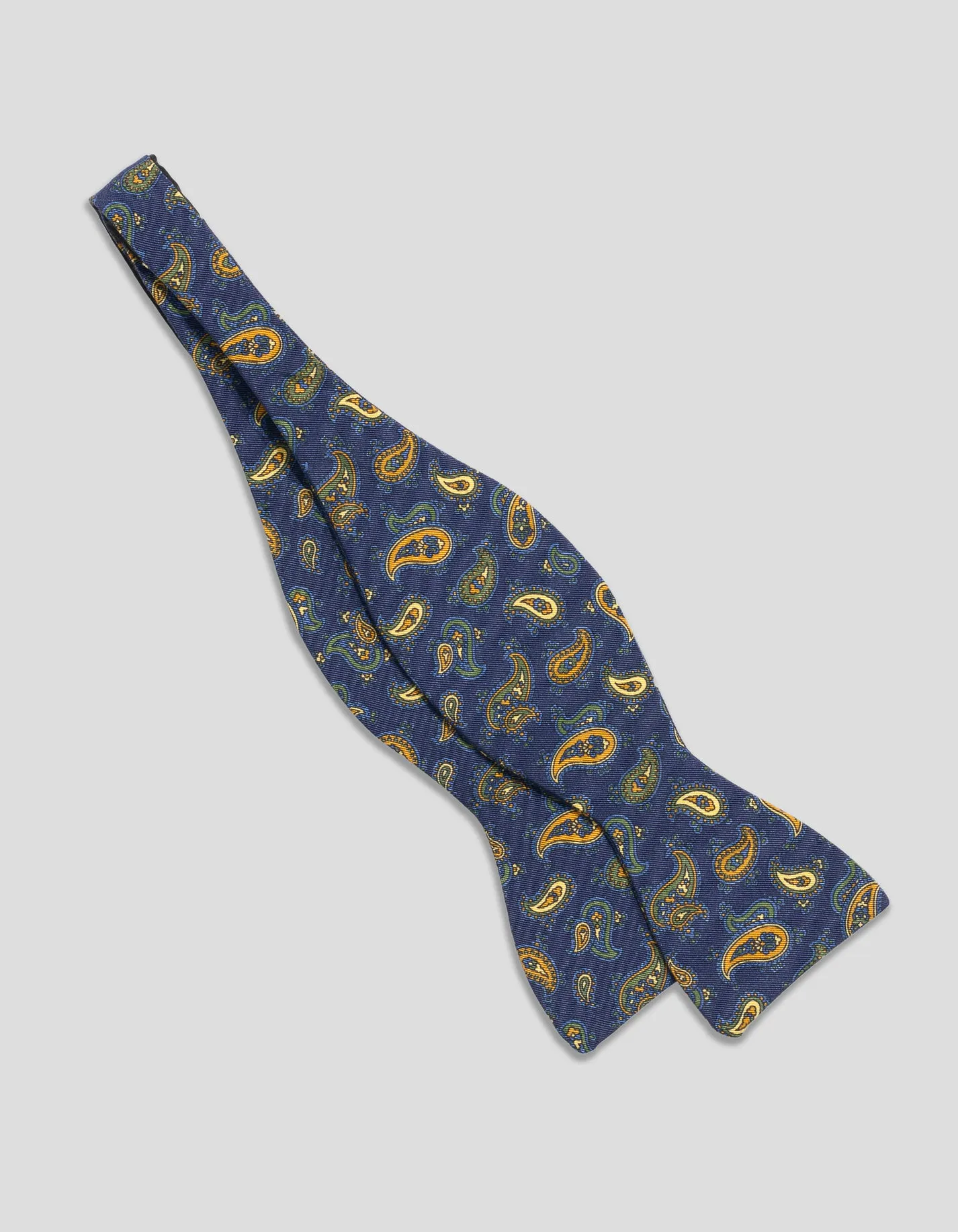 Made-in-UK Navy & Yellow Paisley Irish Poplin Bow Tie sold by J. Press