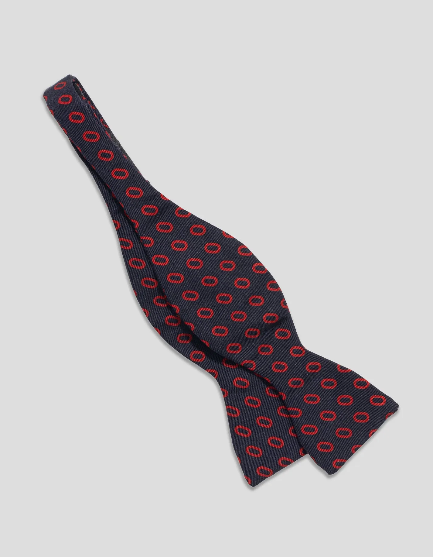 Made-in-England Black & Red Pine Cones Irish Poplin Bow Tie sold by J. Press