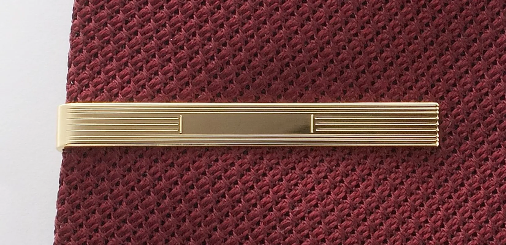 GOLD ETCHED TIE BAR sold by J. Press