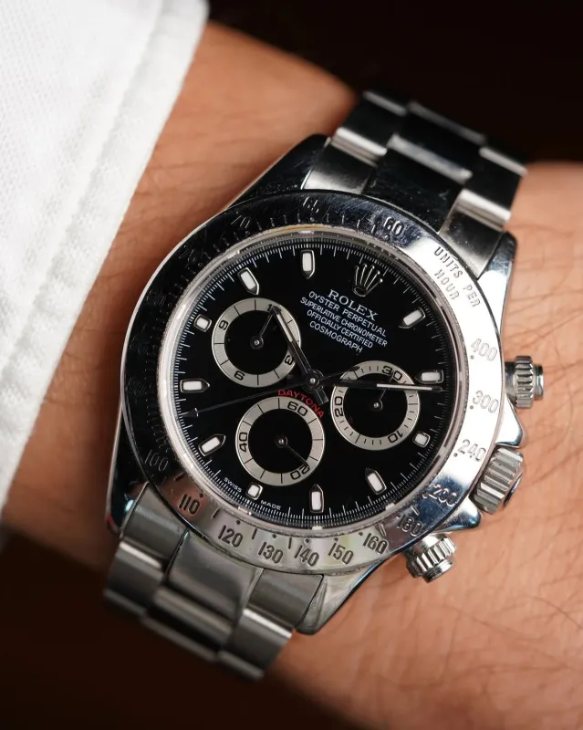 Rolex Daytona Ref. 116520 Black Dial Full Set And Service Papers sold by J. Press