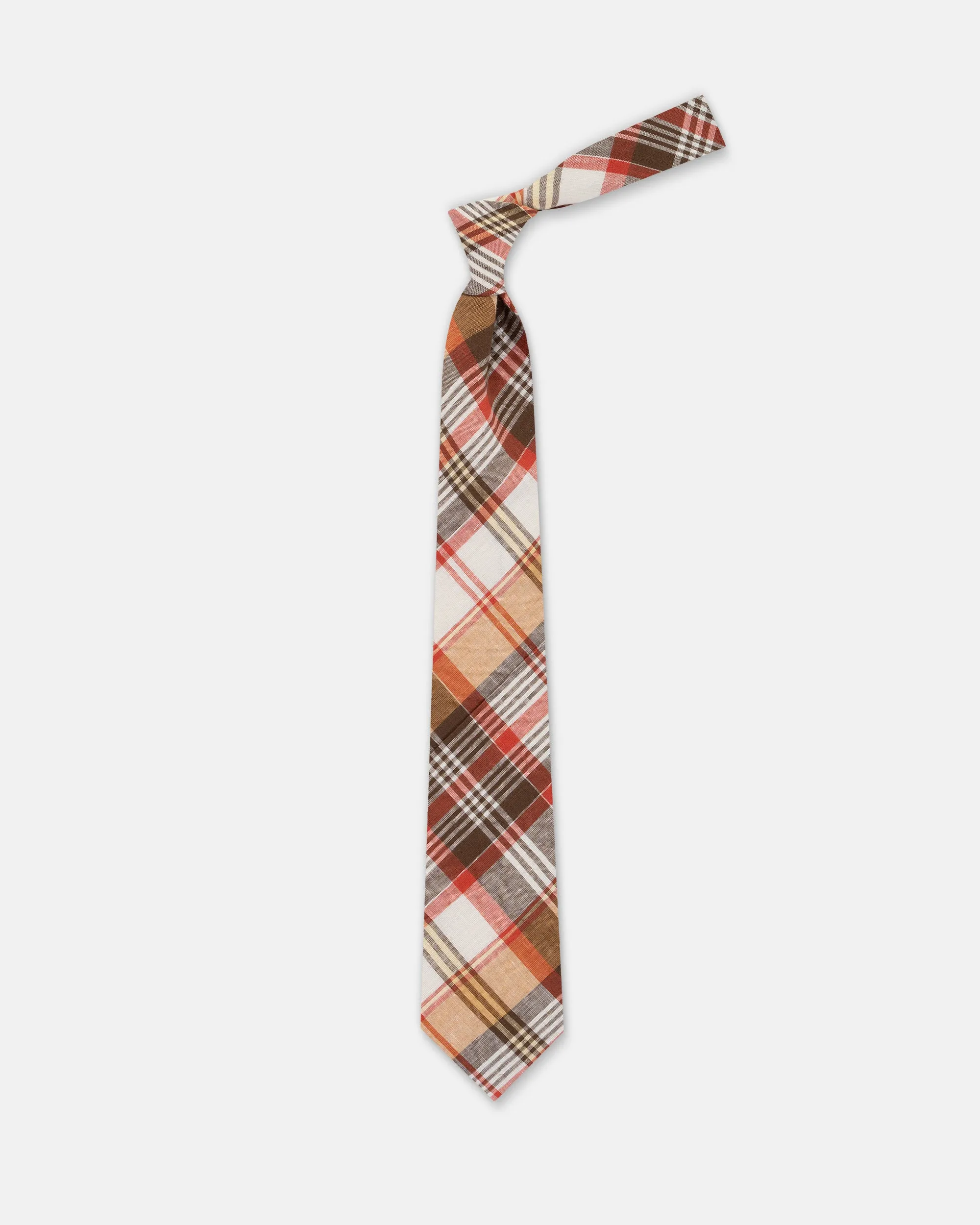 Made-in-USA Brown, White, & Red Madras Tie sold by J. Press