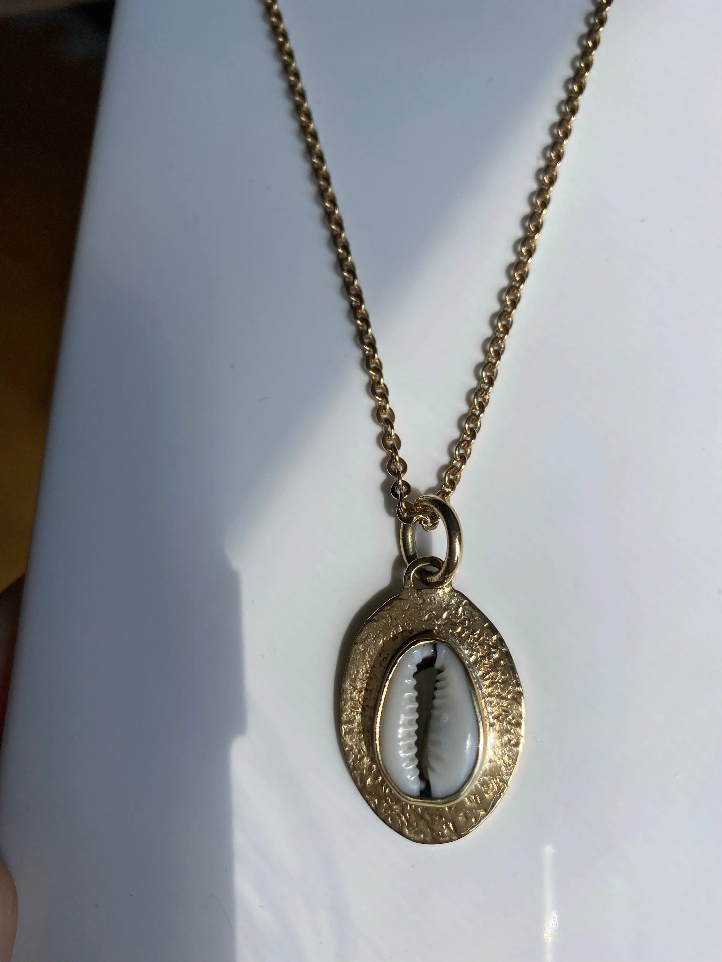 Cowrie amulet sold by Lissa Bowie