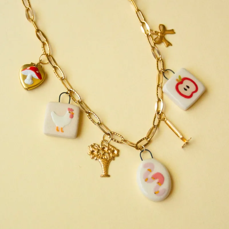 Worm Charm Necklace sold by Meghan MacWhirter