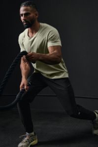 The Triumph Crew Neck Tee - Limestone sold by Alo Yoga