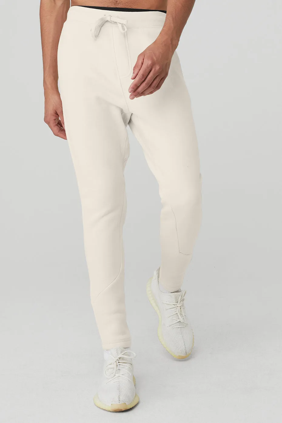 The Triumph Sweatpant - Bone sold by Alo Yoga