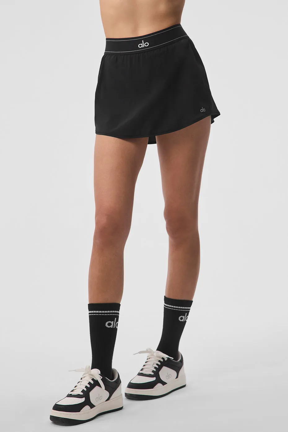 Match Point Tennis Skirt - Black sold by Alo Yoga
