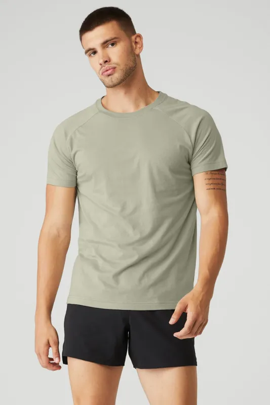 The Triumph Crew Neck Tee - Limestone sold by Alo Yoga