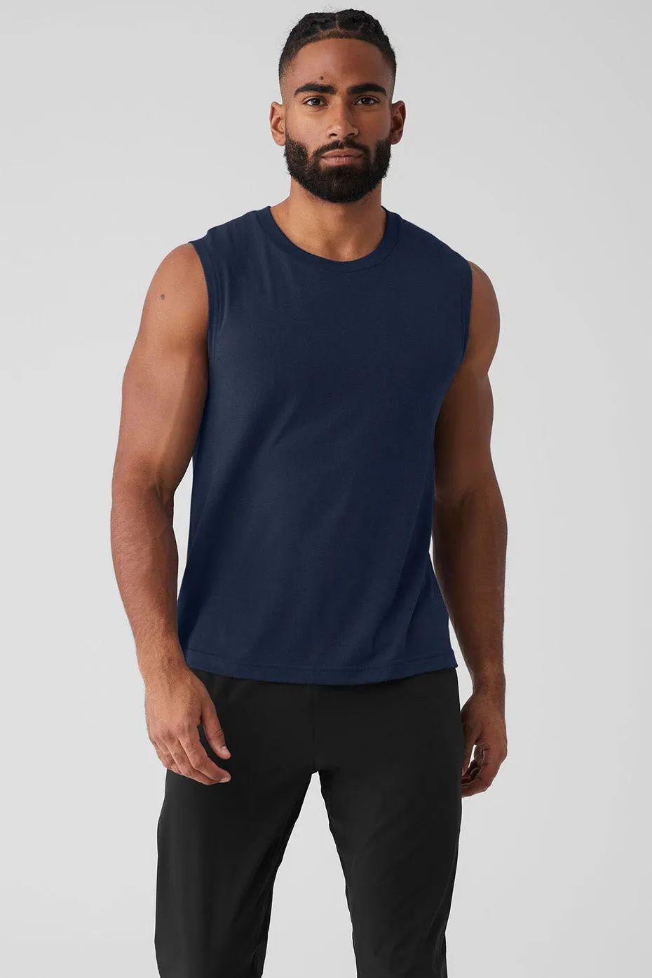 The Triumph Muscle Tank - Navy sold by Alo Yoga