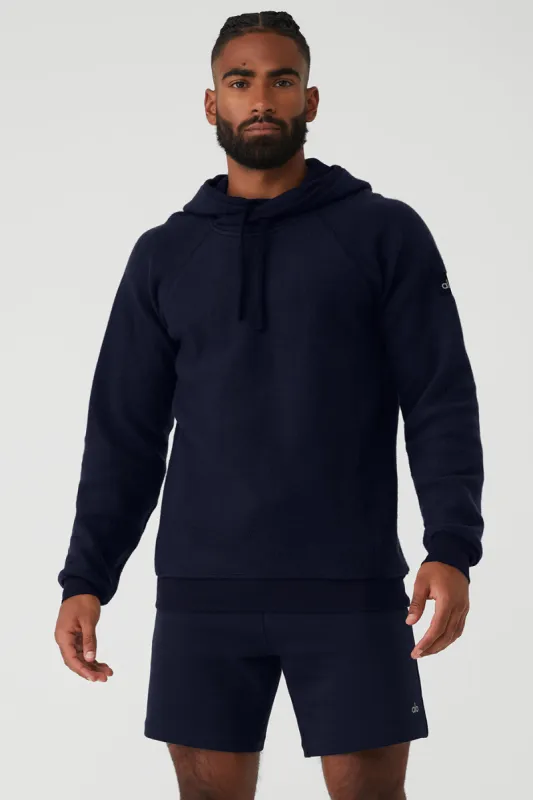 The Triumph Hoodie - Navy sold by Alo Yoga