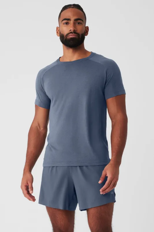 The Triumph Crew Neck Tee - Bluestone sold by Alo Yoga