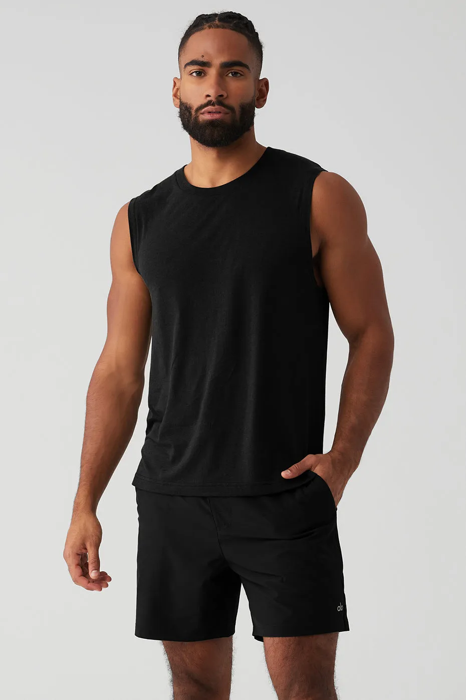 The Triumph Muscle Tank - Black sold by Alo Yoga