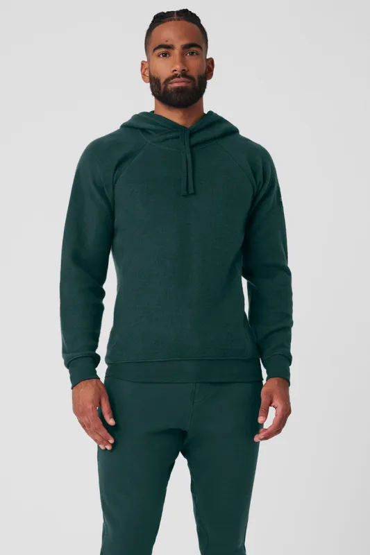 The Triumph Hoodie - Midnight Green sold by Alo Yoga