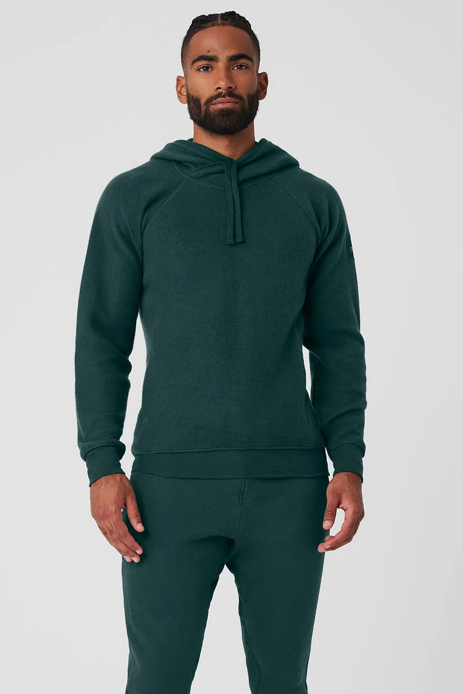 The Triumph Hoodie - Midnight Green sold by Alo Yoga