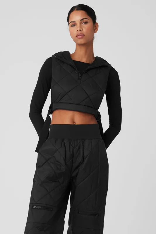 Cropped Snowrider Sleeveless Puffer Top - Black sold by Alo Yoga