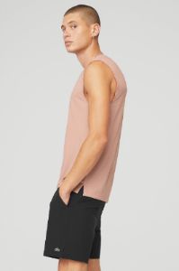The Triumph Muscle Tank - Soft Clay sold by Alo Yoga
