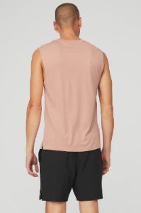 The Triumph Muscle Tank - Soft Clay sold by Alo Yoga