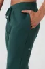 The Triumph Sweatpant - Midnight Green sold by Alo Yoga