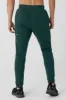 The Triumph Sweatpant - Midnight Green sold by Alo Yoga