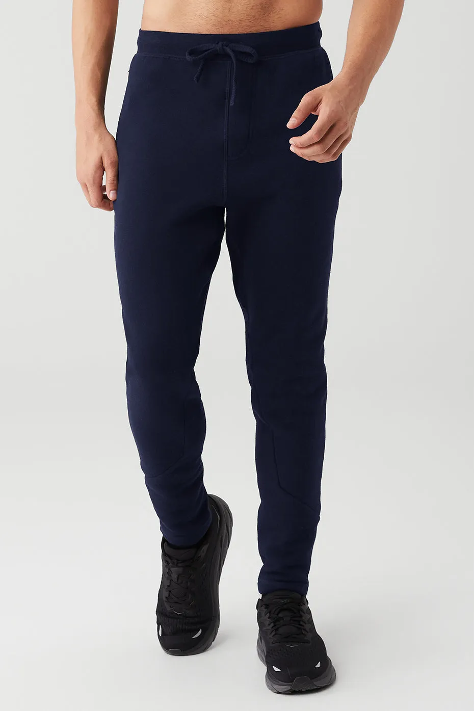 The Triumph Sweatpant - Navy sold by Alo Yoga