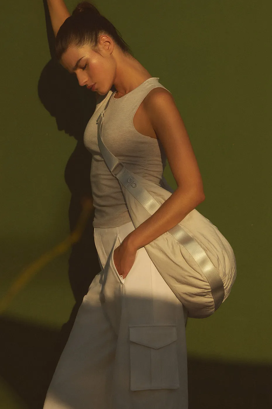 Om The Go Gym Sling Bag - Bone sold by Alo Yoga