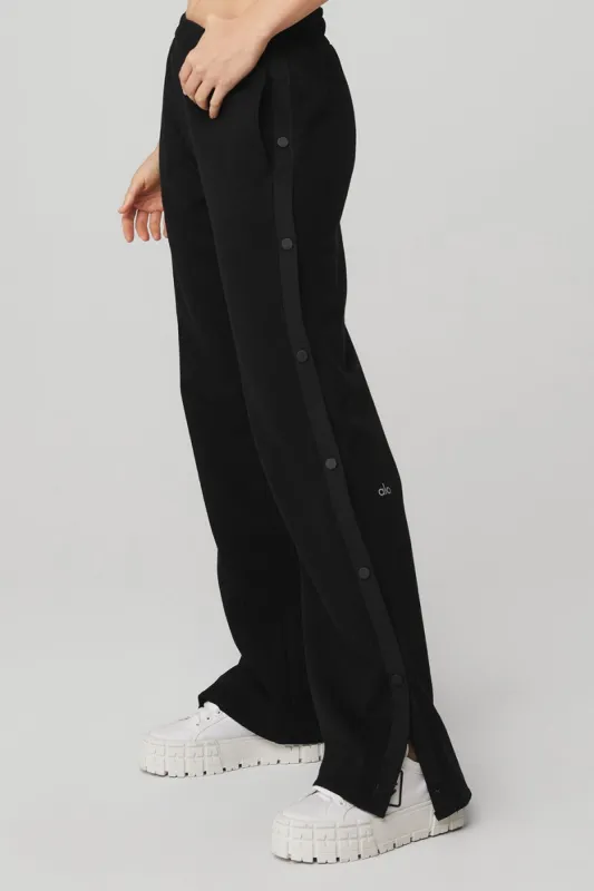 Courtside Tearaway Snap Pant - Black sold by Alo Yoga