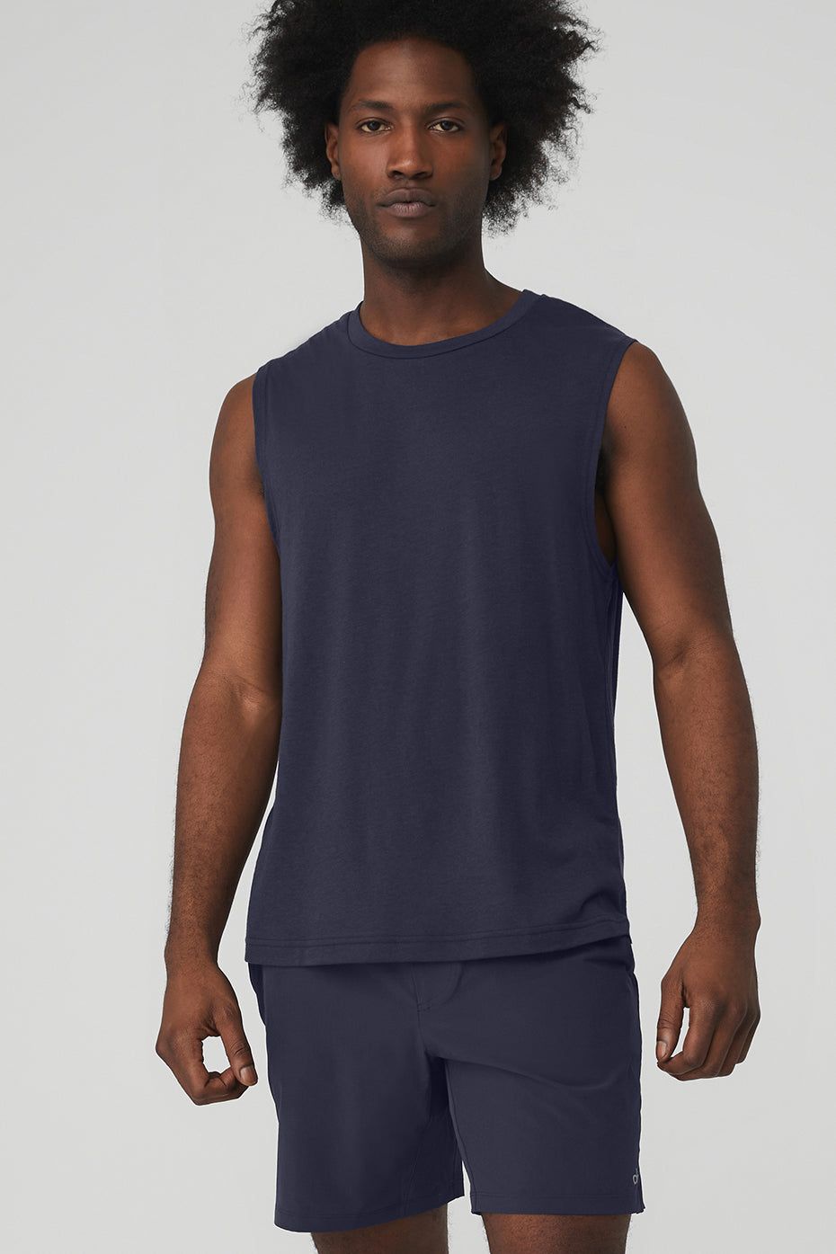 The Triumph Muscle Tank - True Navy sold by Alo Yoga