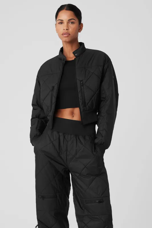 Snowrider Puffer Jacket - Black sold by Alo Yoga