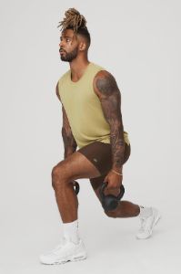The Triumph Muscle Tank - Wasabi sold by Alo Yoga
