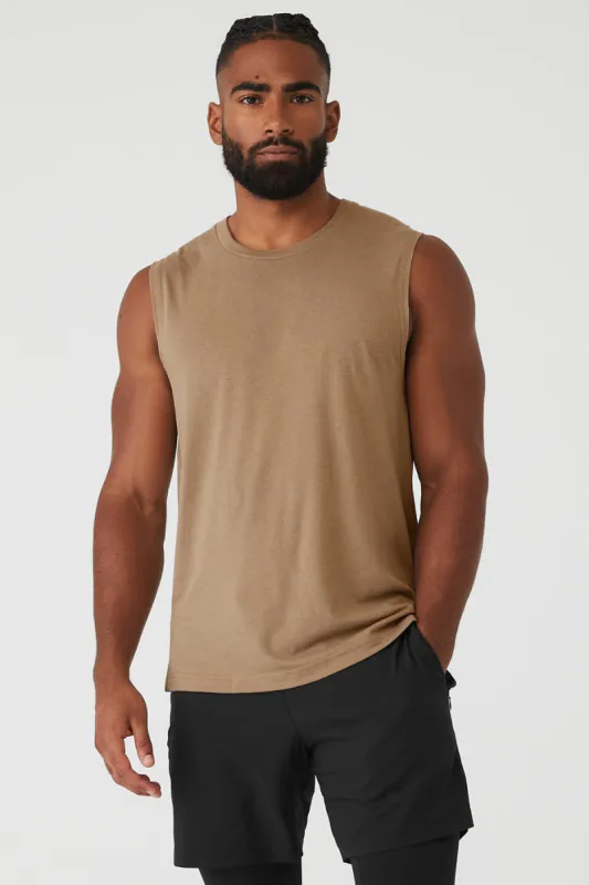 The Triumph Muscle Tank - Gravel sold by Alo Yoga