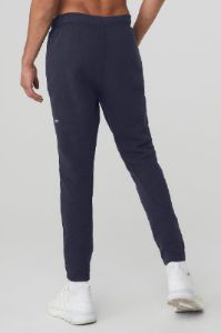 The Triumph Sweatpant - True Navy sold by Alo Yoga