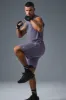 The Triumph Muscle Tank - Italian Plum sold by Alo Yoga