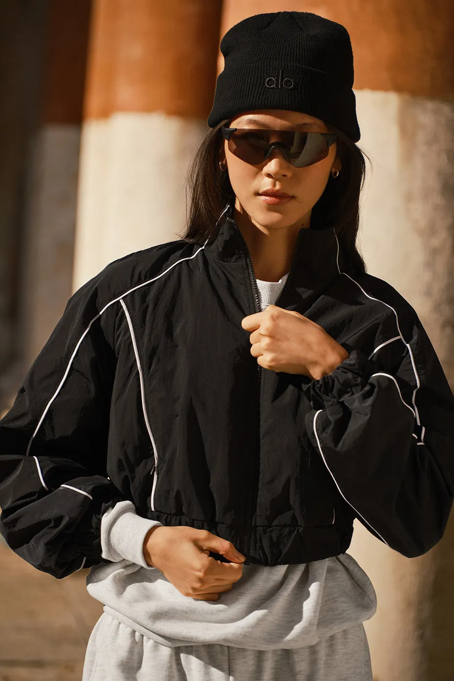 Motivate Full-Zip Track Jacket - Black/White sold by Alo Yoga