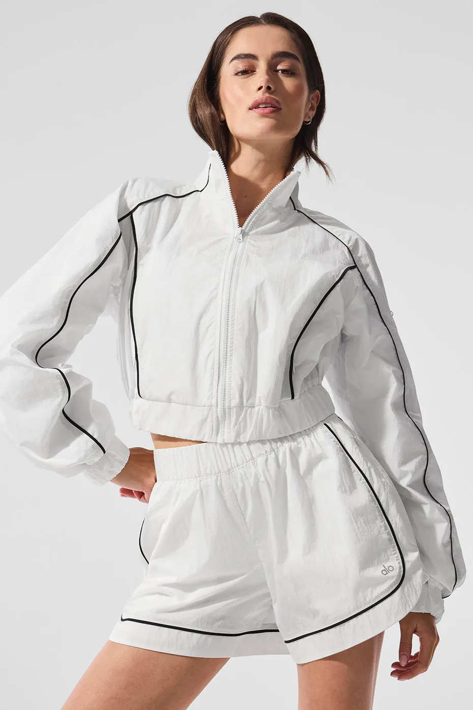 Motivate Full-Zip Track Jacket - White/Black sold by Alo Yoga