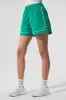 Motivate Track Short - Spruce Green/White sold by Alo Yoga