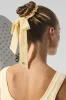 Love Knots Tie Scrunchie - Warm Butter sold by Alo Yoga