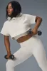 Cropped In The Air Short Sleeve Hoodie - Ivory sold by Alo Yoga