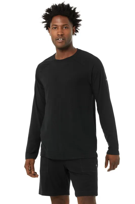 Triumph Long Sleeve Tee - Solid Black Triblend sold by Alo Yoga