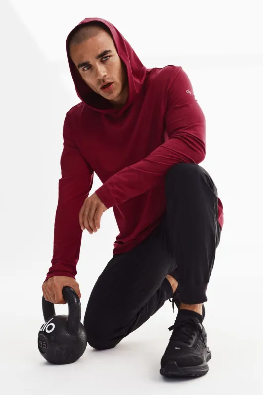 Conquer Reform Long Sleeve With Hood - Garnet made by Alo Yoga
