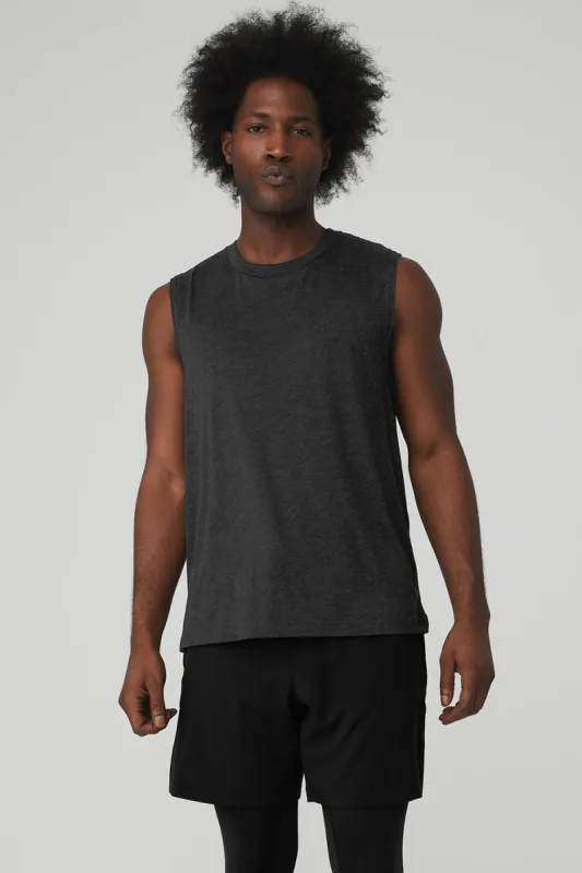 The Triumph Muscle Tank - Black Heather sold by Alo Yoga