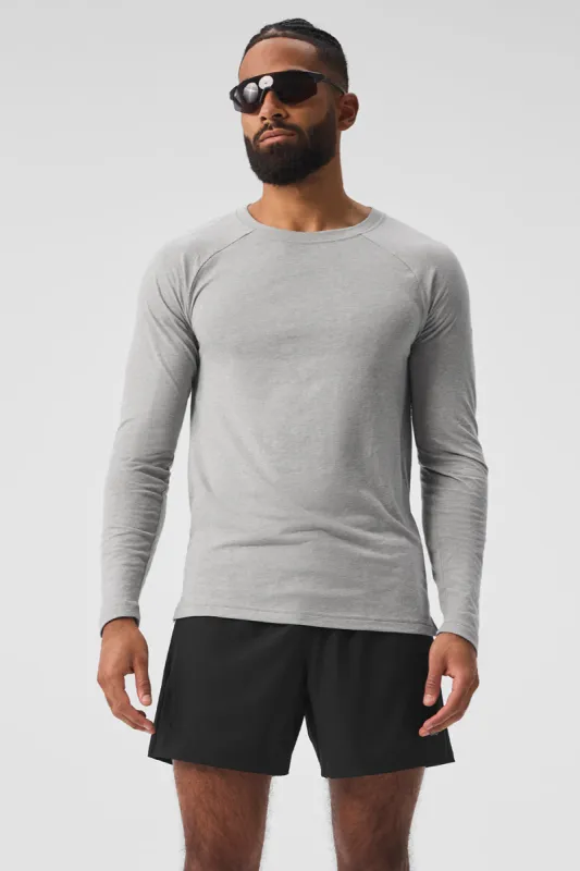 Triumph Long Sleeve Tee - Athletic Heather Grey sold by Alo Yoga